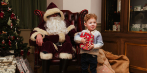 Father Christmas and a child at Temple Newsam